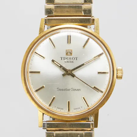 Herrur Tissot, 18K, manuell, monocoque, repigt glas, opersonlig gravyr, defekt, går ej, flexband i metall ej original, inga tillbehör. 