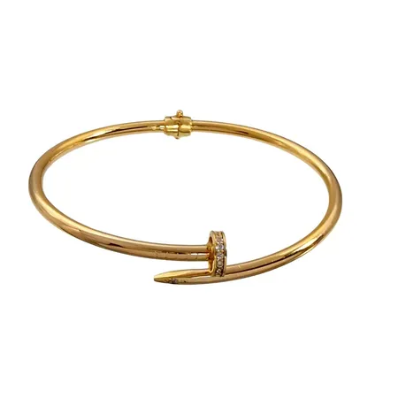Armring, 18K guld, oval öppningsbar modell, vita stenar, inre omkrets 17,0 cm, bredd 3-8 mm, fint skick Vikt: 7,9 g