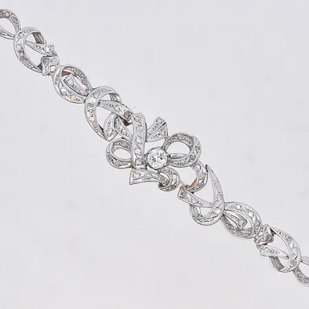 Armband med diamant 0,23ctv, längd 18 cm, bredd 7-15 mm, vitguld/rödguld, 18K. Vikt: 16,5 g