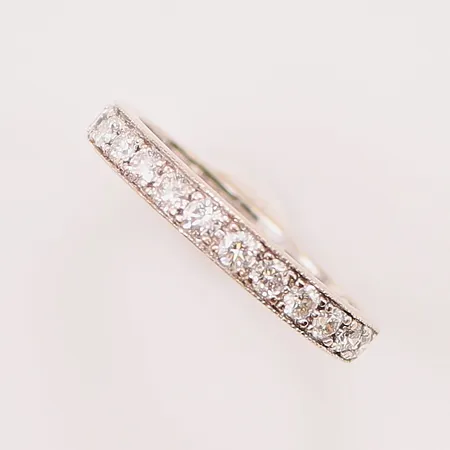 Ring, halvallians, diamanter 13x ca 0,04ct, ca 0,52ctv, Ø17½, bredd:3mm, gravyr, 18K 3,4g.