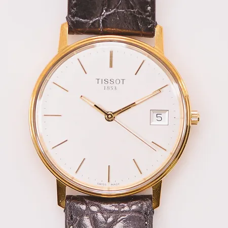Herrur Tissot 18K, 33,5mm, quartz, går ej, graverad.