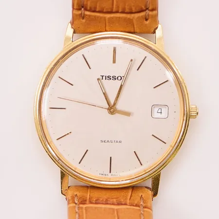 Herrur Tissot Seastar 18K, 33,5mm, quartz, graverad, går ej.