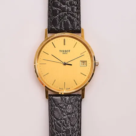 Herrur Tissot 18K, 33,5mm, quartz, graverad, går ej, originalbox.