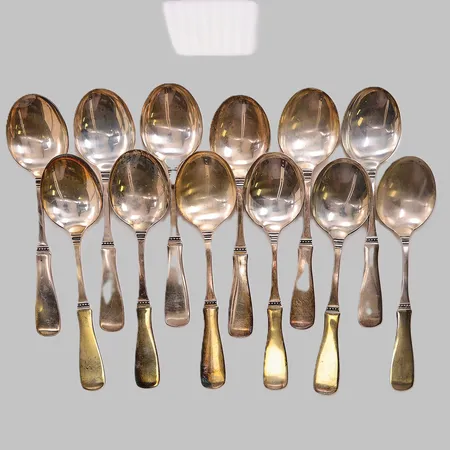 12 Matskedar, 18,5cm, 830/1000 Silver 605,6g.