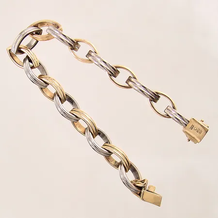 Armband, tvåfärgad, längd: 19,5cm, bredd: 9,8mm, skev låsåtta, 18K  Vikt: 54,1 g