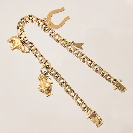 Armband Bismarck med fyra berlocker, längd: 17,5cm, bredd: 5,2mm, smärre bucklor på berlocker, 18K  Vikt: 15 g