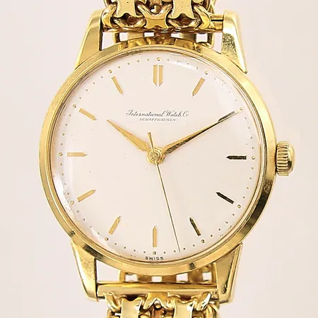 Herrur IWC, 18K, manuell, X-länk i 18K, Ø35mm, repigt plexiglas, boett samt länk med repor, ena låsåttan defekt, gravyr, inga tillbehör, bruttovikt: 71g