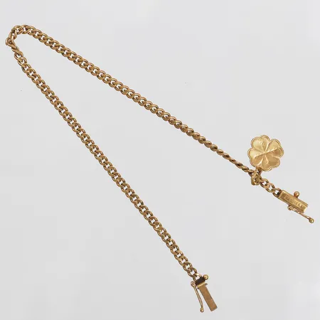 Armband, Pansarlänk, med berlock i form av ett fyrklöver, längd 18cm, bredd 2mm, berlock Ø 10mm, gravyr, 18K guld Vikt: 4,8 g