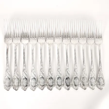 Tolv matgafflar med monogram, Gustaf Möllenborg, Stockholm, 1899, längd 21,5cm, bruksslitage, silver. Vikt: 987 g