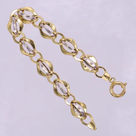 Armband, längd 20,5cm, bredd 12mm, ihålig, buckliga länkar, vit/gult guld 18K.  Vikt: 9 g