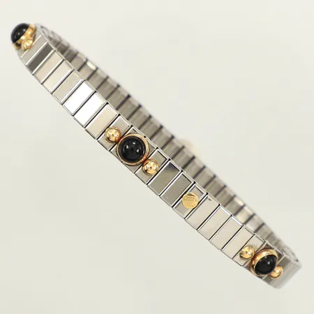 Flexarmband, stål, svarta stenar, gulddetaljer i 18K, bruttovikt: 14g Vikt: 14 g