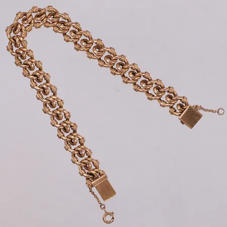 Armband, längd 19,5cm, bredd 11mm, säkerhetskedja. 18K  Vikt: 30,8 g