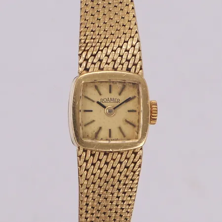 Damur, Roamer 18K, manuell, boettnr 466 8621 707, integrerad länk i 18K, skevt, 18K, längd inklusive uret: ca 18cm, bruttovikt: 31,6g Vikt: 31,6 g