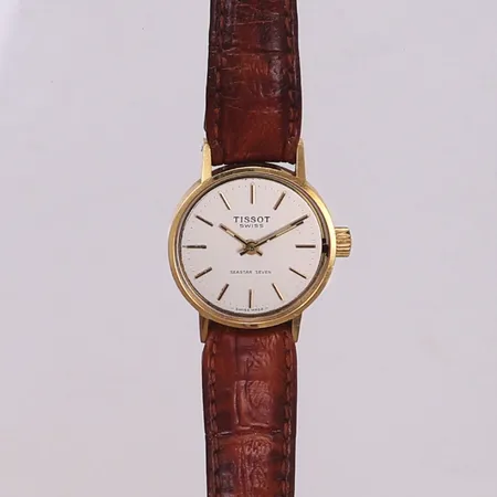 Damur Tissot Seastar Seven 18K, 21,8mm, quartz, defekt, går ej, saknar glas, slitet läderband, gravyr "För nit och redlighet i rikets tjänst", bruttovikt: 15,6g Vikt: 15,6 g