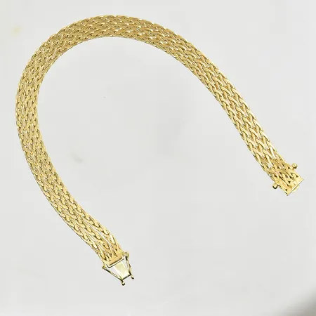 Armband, treradigt, längd 20 cm, bredd 7 mm, 18K. Vikt: 21,2 g