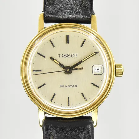 Damur Tissot Seastar 18K, boett Ø22 mm, quartz, datum, slitet läderband, graverad bakboett, behov av batteribyte, bruttovikt 14,6g, inga tillbehör.