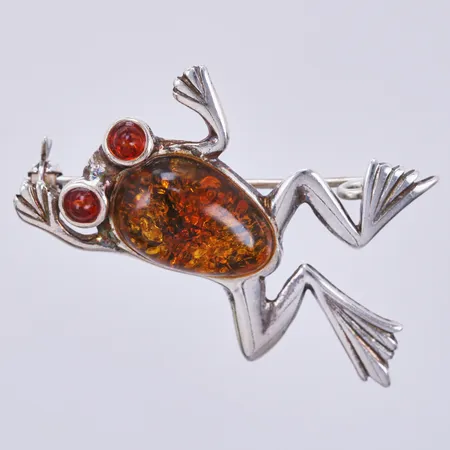 Brosch med bärnsten, otydlig stämpel KK på nålen? längd ca 35mm, bredd ca 25mm, 925/1000 silver Vikt: 4 g