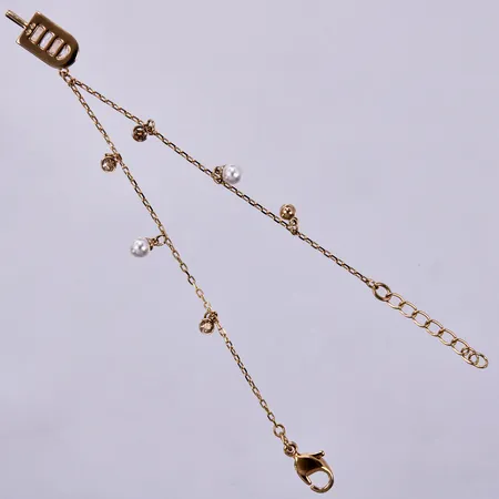 Armband Swarovski med berlocker, gulmetall, längd ca 16cm Vikt: 2,4 g