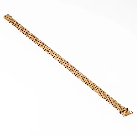 Armband, korridorlänk i 14K guld. Det är 7 mm brett, 19 cm långt och väger 13,2g. Kistlås. Stämplad 585 (14K).