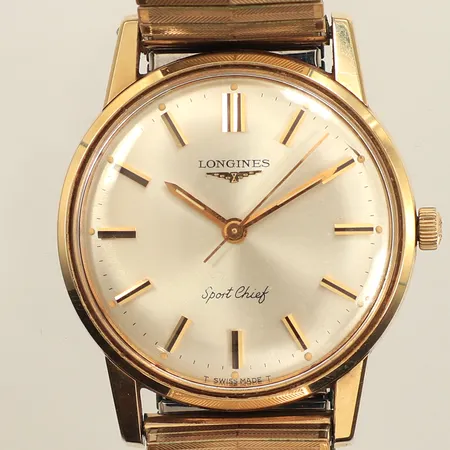 Herrur Longines Sport Chief, guld på stål, manuell, 34mm, smärre repor på plexiglas och boett, flexarmband i stål, inga tillbehör. 