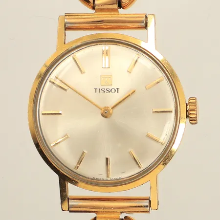 Armbandsur Tissot, boett i 18K, länk i metall, färgbortfall på länk, bakboett kräver key nr: 230T, repigt glas,   bruttovikt: 33,7g