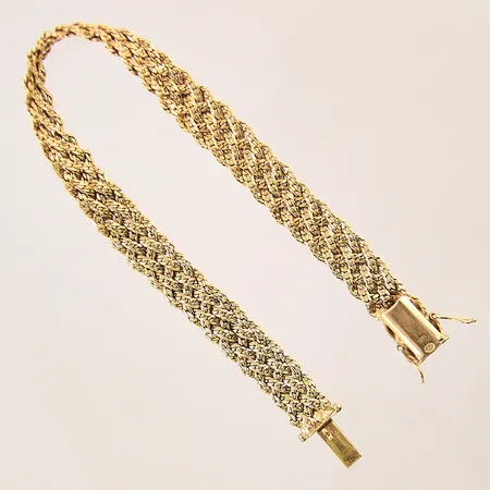 Armband flätad, längd: 19cm, bredd: 7,8mm, 18K  Vikt: 17,8 g