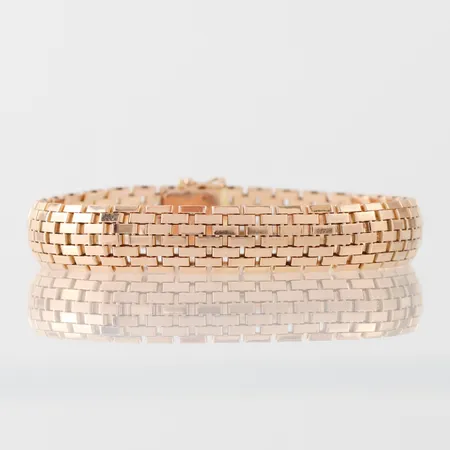 Armband lite kupat, längd ca 19 cm, bredd 11.1 mm, 18k. Vikt: 30,1 g