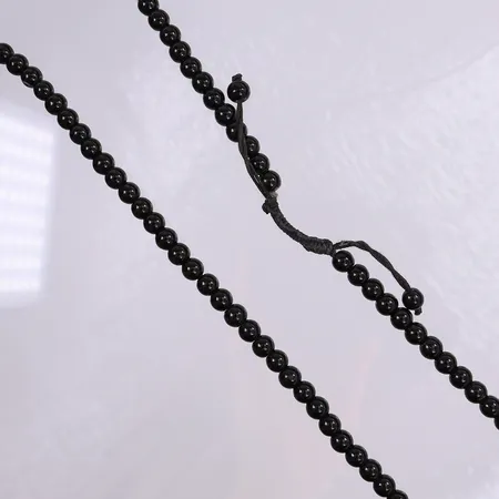 Collier med svarta kulor, längd ca 70cm, Ø6mm. 