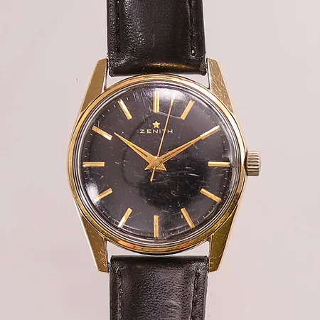 Herrur Zenith, 34mm, guld på stål, manuell, svart urtavla, verknr:5158833, boettnr:9659163, något repigt plexiglas, läderband.