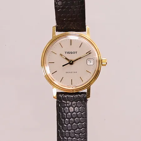 Damur Tissot 18K, 21mm, quartz, går ej, gravyr, läderband.