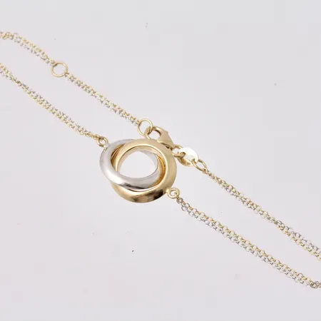  Armband i 18K guld/vitguld, 17cm och 19cm, Ankar i två rader, bredd 0,9mm, hänge, mått 13,6x15,5mm, tillverkad av Svedbom & Co AB, vikt 2,71g.