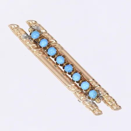 Brosch med turkosa stenar, 53x10mm, påtagligt slitage, nål ej guld, 14K Bruttovikt: 4,2g Vikt: 4,2 g
