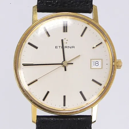 Herrur Eterna, Ø33mm, quartz, datum, boett 18K, tjänstegravyr, repigt glas, med skadat originalarmband och spänne i dubblé, originalask, Bruttovikt: 25,2g