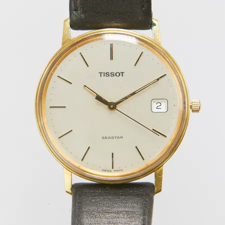 Herrur Tissot Seastar, 18K, quartz, 33,8mm, opersonlig gravyr, repigt glas, repig bakboett, monocoque, slitet läderband samt bygelspänne, inga tillbehör.