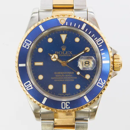 Herrur Rolex Submariner, stål/guld, automatisk, 40mm, ref 16613, snr: X760448 ca 1991, Cal 3135, verknummer 6730344, safirglas, datum, repig dykring, ej tidsenlig oysterlänk, ref: 93153-S12 ca 1994, viklås, certifikat daterat 11-12-1994 Schiphol