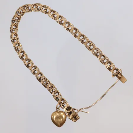 Armband Bismarck med berlock, 16,5cm, bredd 5mm, säkerhetskedja, påtagligt bruksslitage, 18K Vikt: 10,6 g