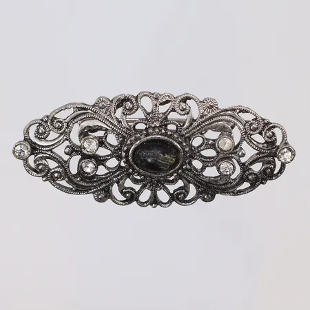 Brosch i Jugend-stil med vita pastestenar och svart emalj (med slitage) 50x21mm  Vikt: 0 g
