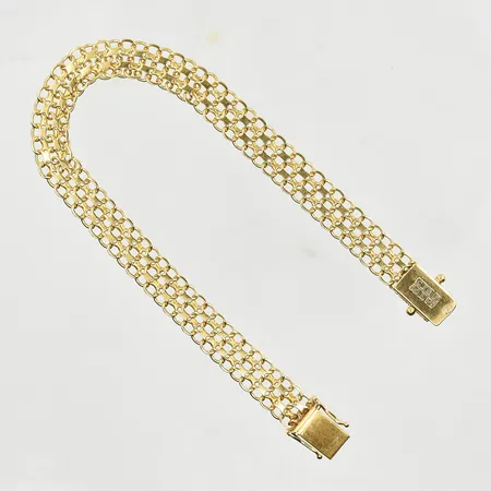 Armband X-länk, längd 19½ cm, bredd 8 mm, 18K. Vikt: 11,9 g