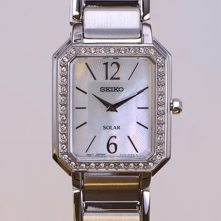 Damur Seiko Solar, vita stenar, 25x28mm, stål, quartz, refnr V115-0DE0, serienr 2N0454, stållänk, originalask skadad