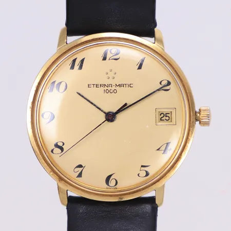 Herrur, Eterna-Matic 100, 18K, 34,5mm, automatisk, datum, plexiglas, mycket trög krona, svart läderband med slitage, inga tillbehör 