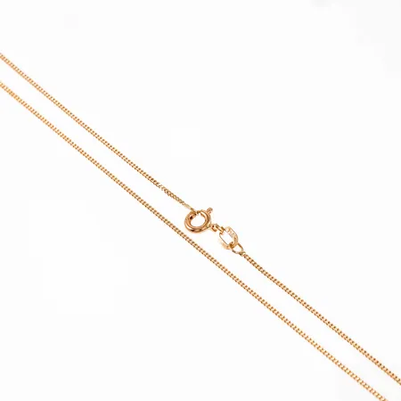 Kedja, pansar i 18K guld. Den är 38 cm lång, 0,95 mm bred och väger 1,5g. Framstår oanvänd. GHA, 750. Springring.