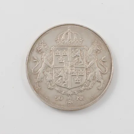  Jubileumsmynt, 50 Kronor, Kungabröllopet 1976, ca Ø 32mm,  925/1000 silver Vikt: 26,8 gram    Vikt: 26,8 g
