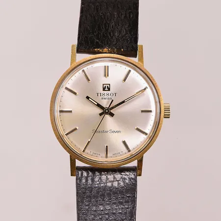 Herrur Tissot Seastar Seven 18K, 33,5mm, manuell, originalband samt spänne, svag missfärgning på urtavla.