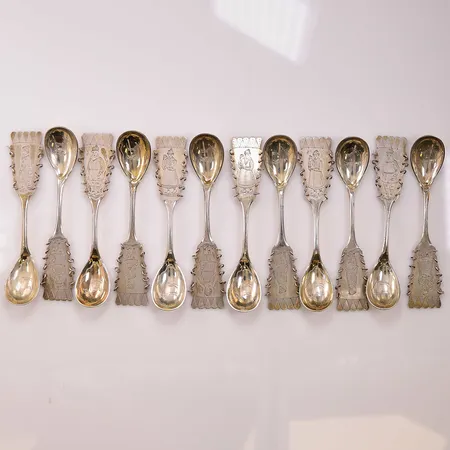 12 Lappskedar, 11cm, monogram, 830/1000 Silver 152,9g.