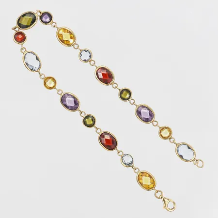 Armband med fasetterade syntetiska stenar, längd 19cm, bredd 6mm, tillverkad av Guldfynd AB, 18K guld Vikt: 6,9 g