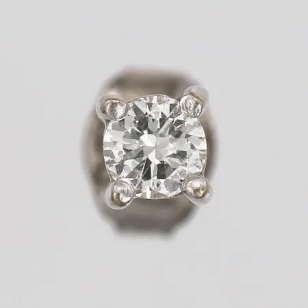 Udda örhänge med diamant ca 0,16ct, Ø3mm, 18K guld, vikt 0,4g, snurrebuss av silver. 
