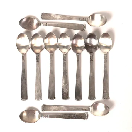 Elva kaffeskedar, modell Rosenholm, GAB, Eskilstuna, 1900-talets andra hälft, längd 12cm, slitage, silver.   Vikt: 185,7 g
