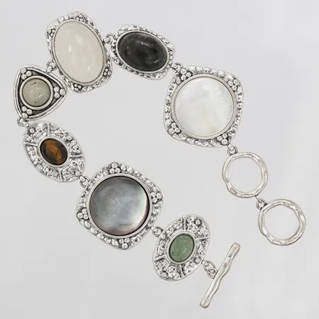 Armband med bland annat tigeröga, pärlemor, mf, längd ca 19cm, bredd 13-26mm, slitage, silver.  Vikt: 31,6 g
