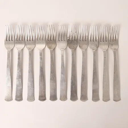 Elva bordsgafflar, modell Rosenholm, formgiven av Jacob Ängman, GAB, Stockholm, 1945, längd 18cm, bruksslitage, en gaffel med sneda tenar.  Vikt: 412,2 g