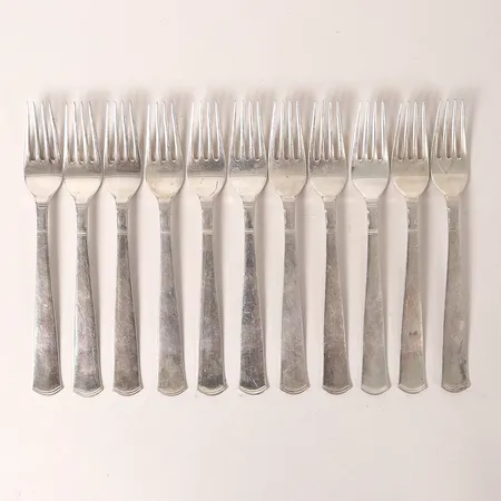 Elva smörgåsgafflar, modell Rosenholm, formgiven av Jacob Ängman, GAB, Stockholm, 1945, längd 14cm, bruksslitage, silver. Vikt: 213,6 g